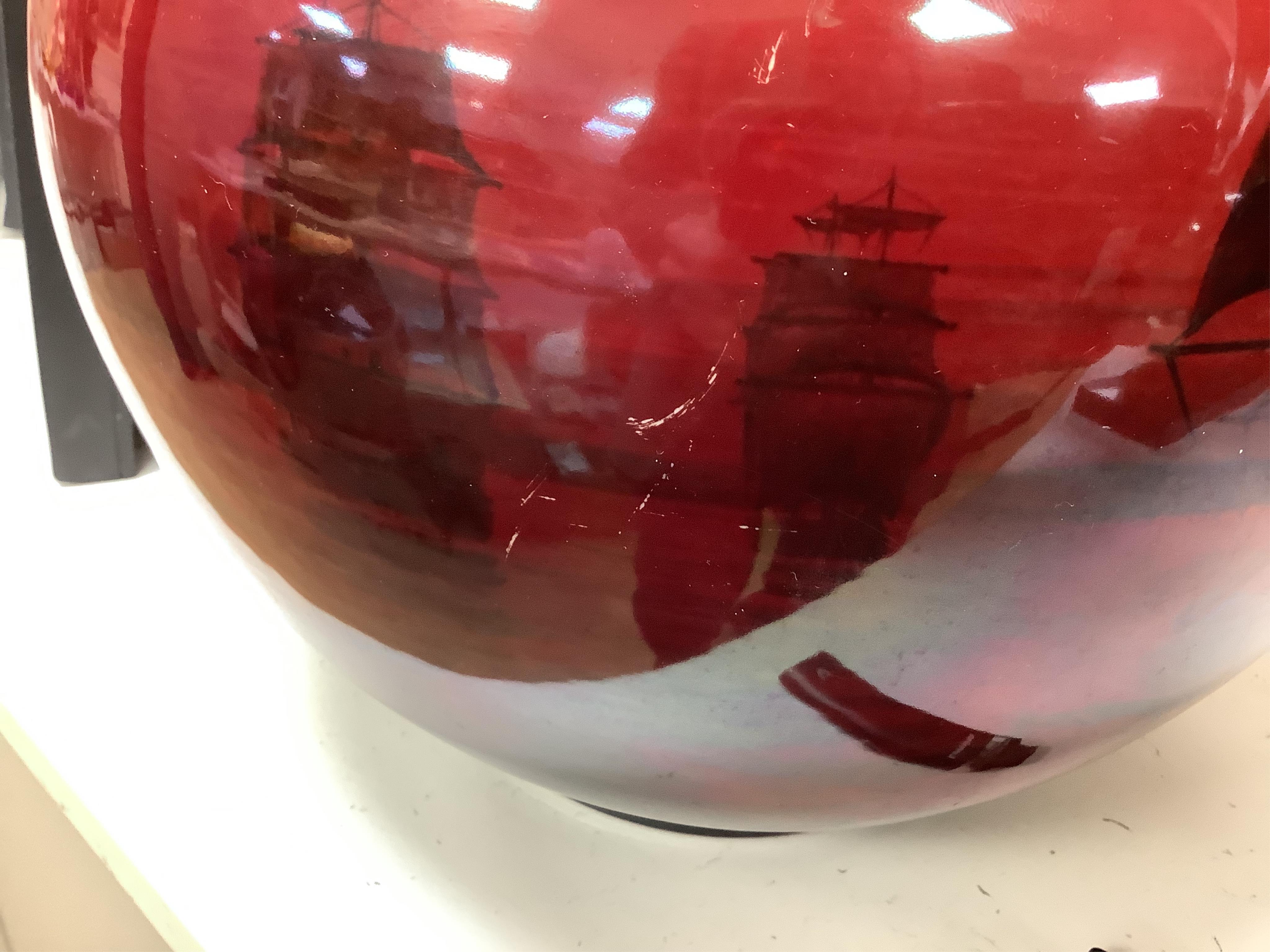 A large Doulton flambe vase decorated with ships, 29cm high